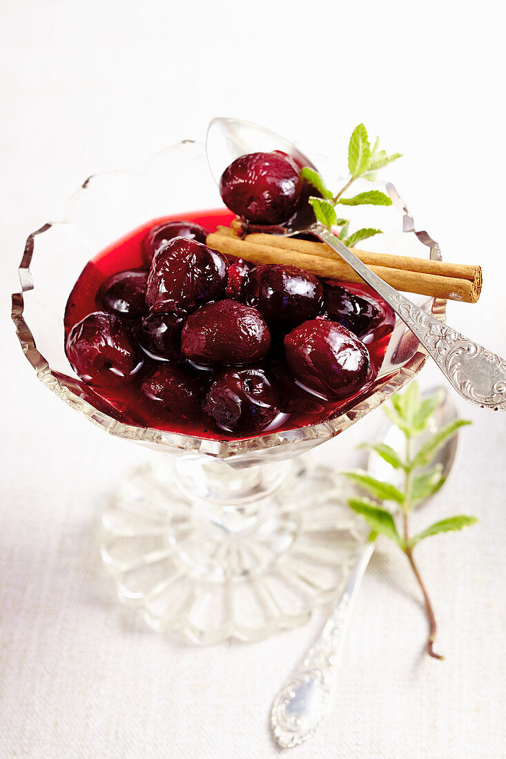 Sour cherries in syrup with lemon, cinnamon and mint