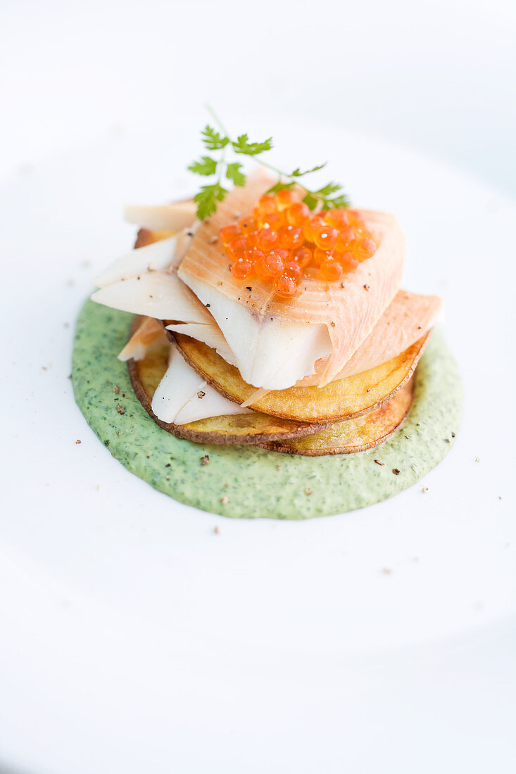 Smoked trout with caviar on crispy potato slices