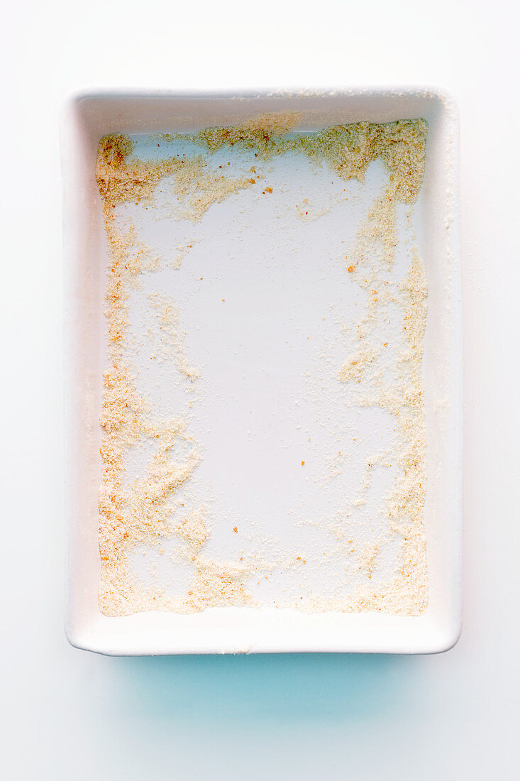 Remains of breadcrumbs in a ceramic dish