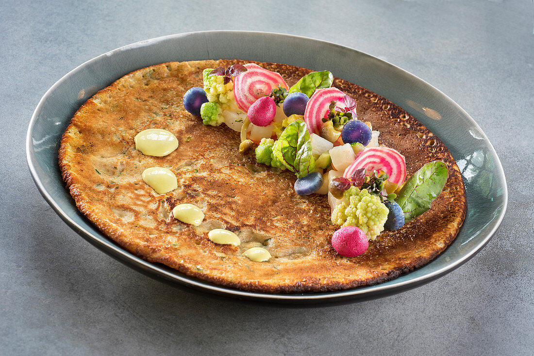 Pancake decorated with vegetables