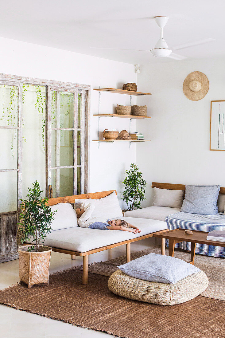 Simple living room in natural tones with wooden furniture