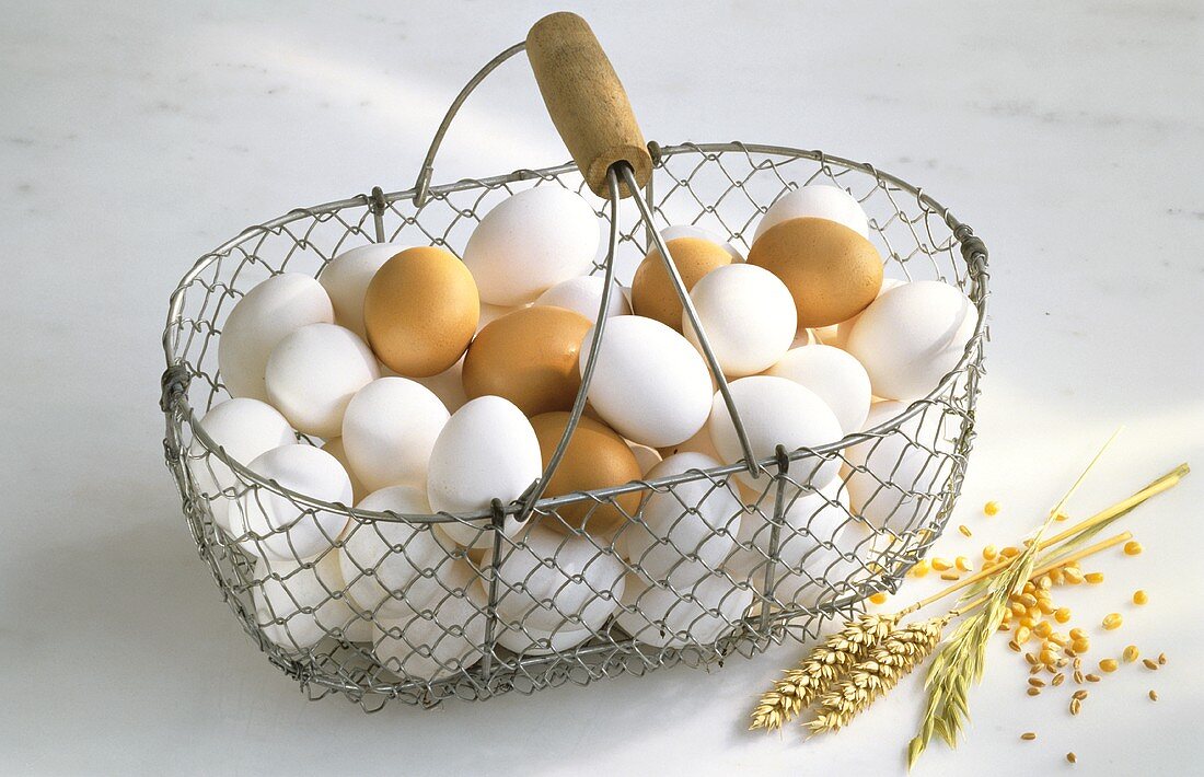 White and Brown Eggs in Wire Basket