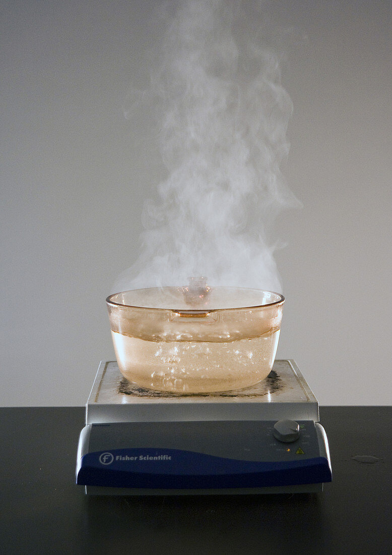 Water Boiling in Amber Glass Pot