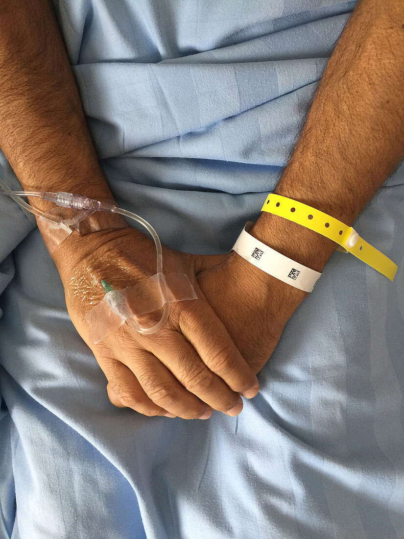 Hospital Patient with IV, ID Bracelet with QR code