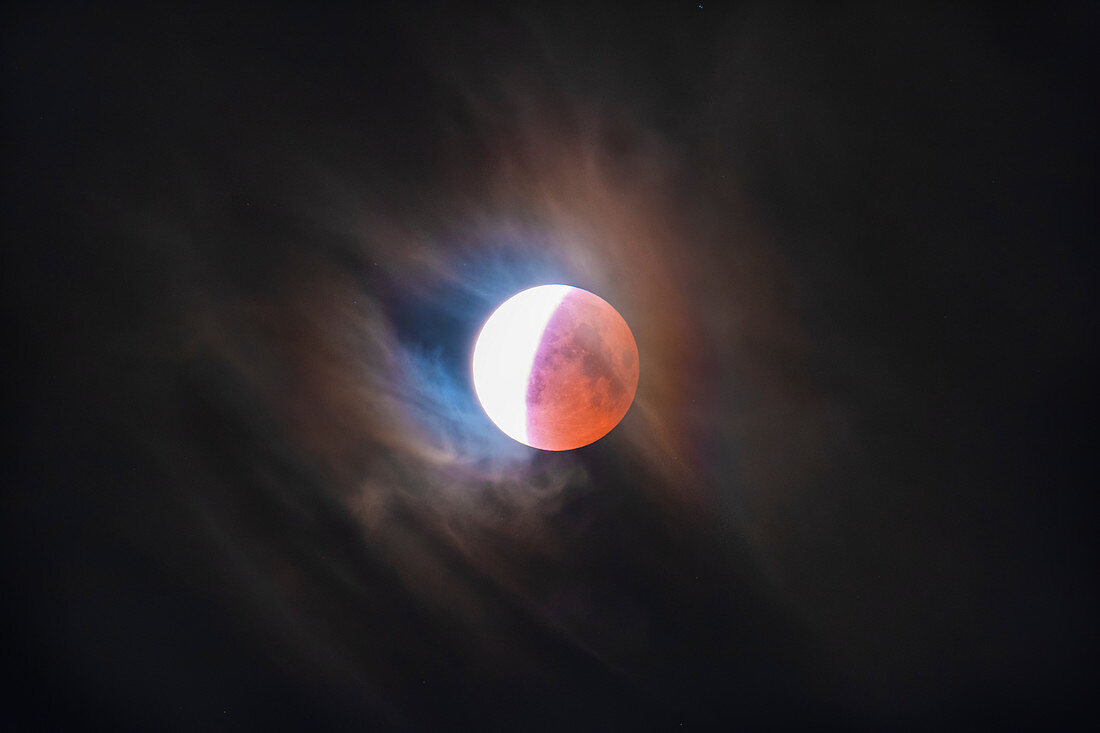 Total lunar eclipse, lunar corona and clouds