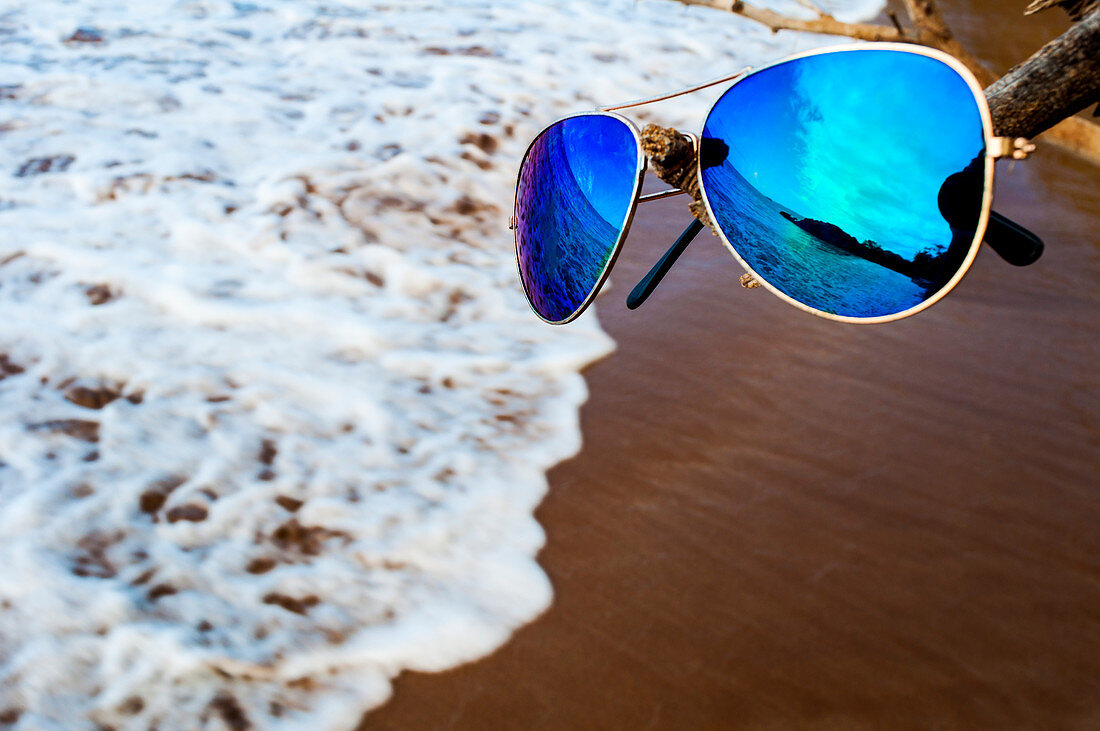 Beach reflected in a pair of sunglasses, Hawaii