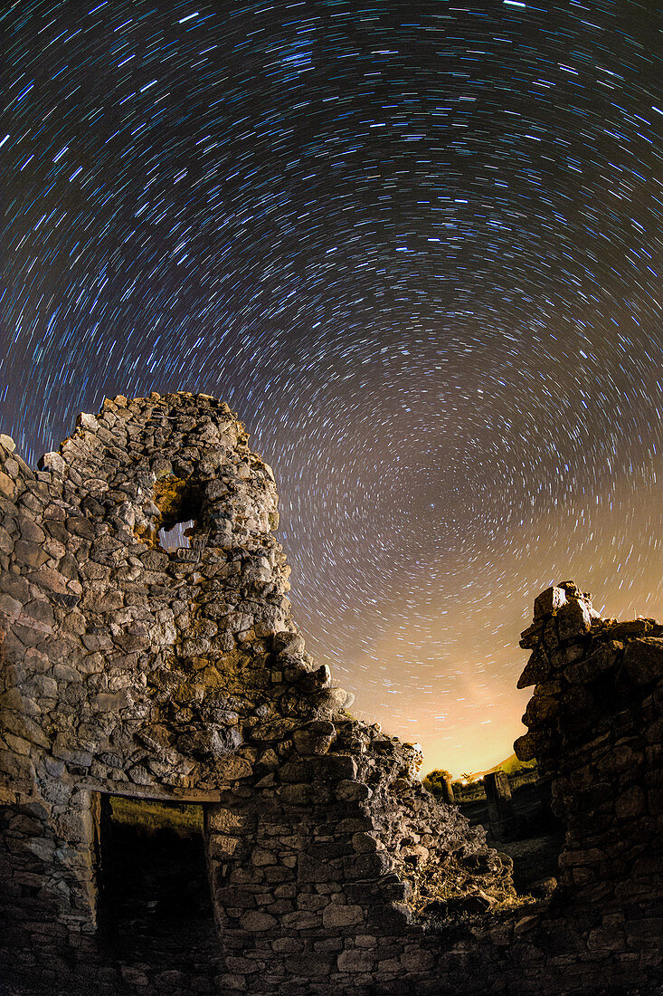 Star trails over Roman ruins, time-exposure image