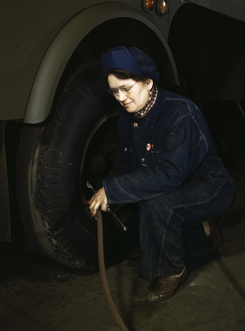 WWII, Woman Checks Tank Tires, 1943