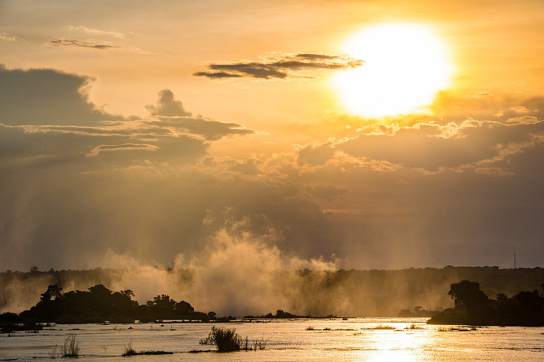 Steam rising from the Zambezi River at sunset, Livingstone,