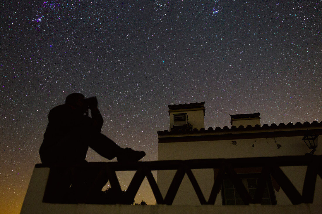 Stargazer viewing a comet