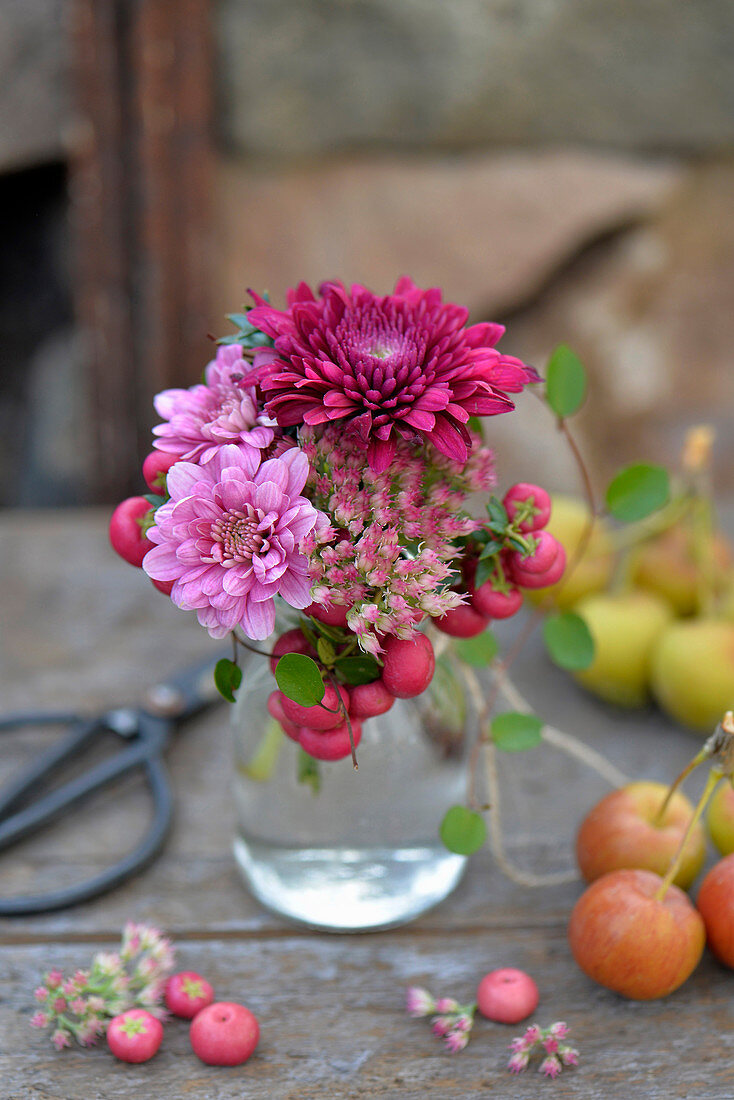 Bouquet of chrysanthemums, sedum and bog myrtle berries