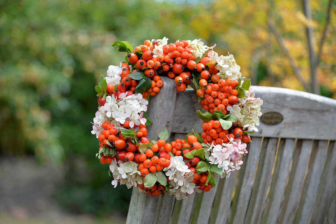 Wreath of rowan berries, hydrangea flowers and rose hips