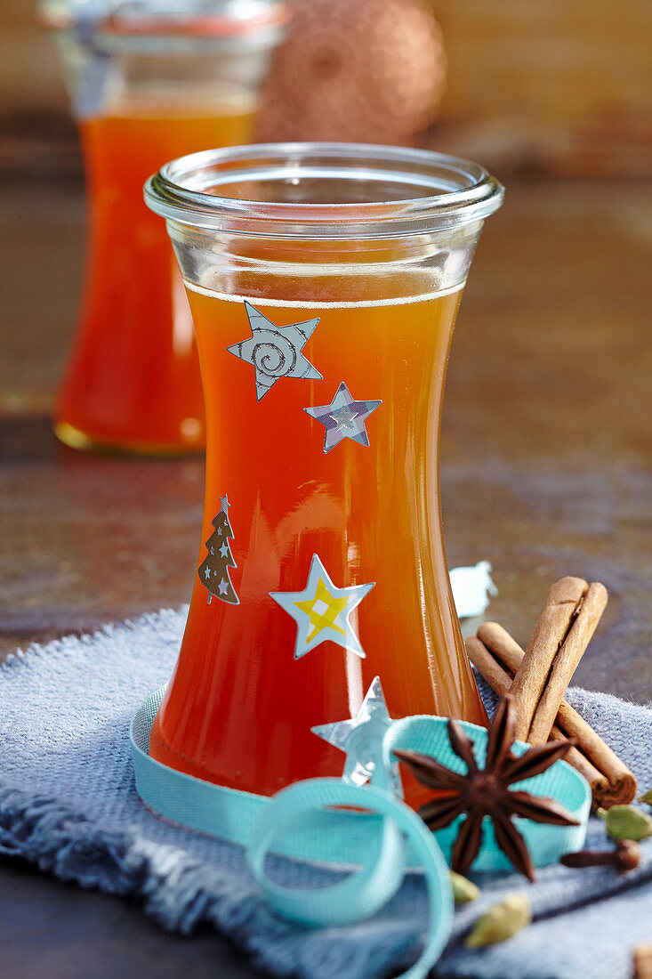 Christmas spiced syrup with cinnamon, cloves and cardamom for punch and hot drinks