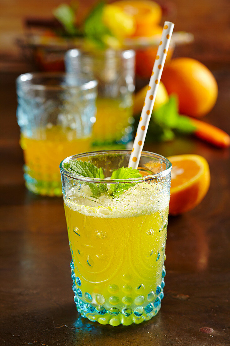 Mineral water with homemade orange syrup as a refreshing drink
