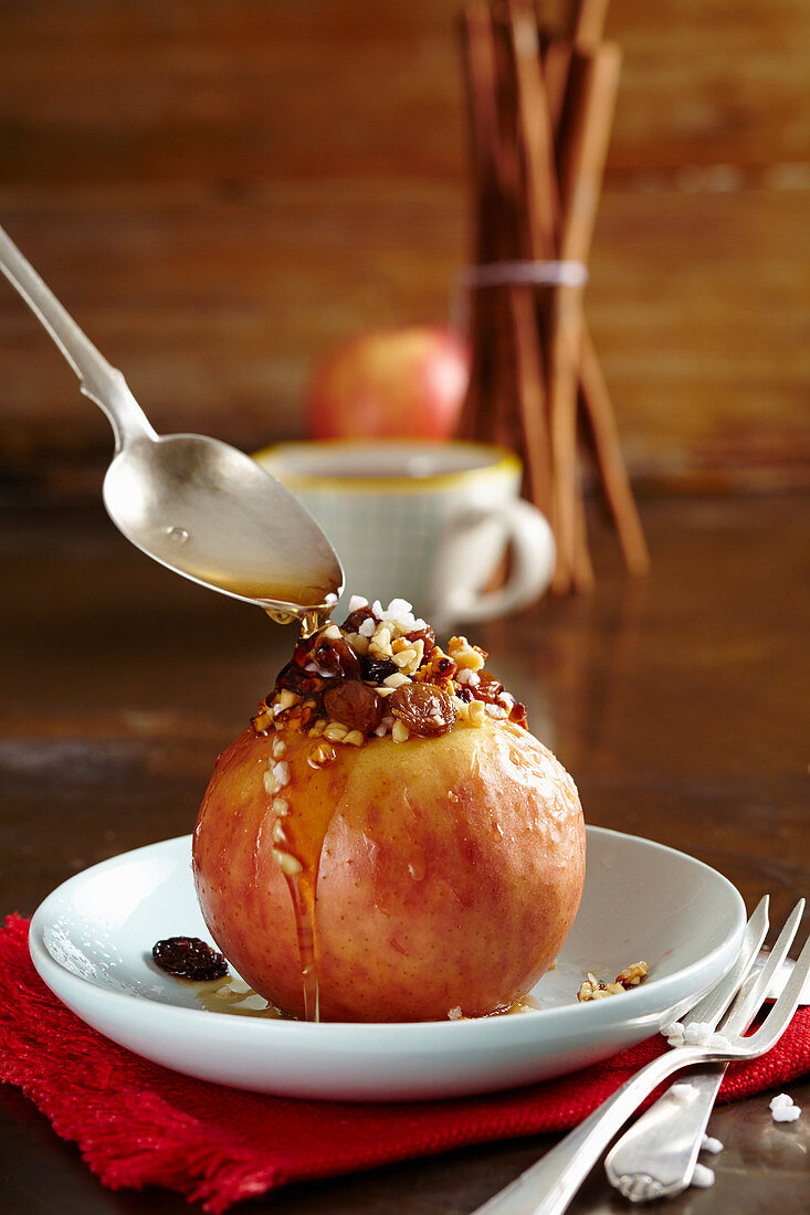 A baked apple with almonds, sultanas and syrup (Christmas)