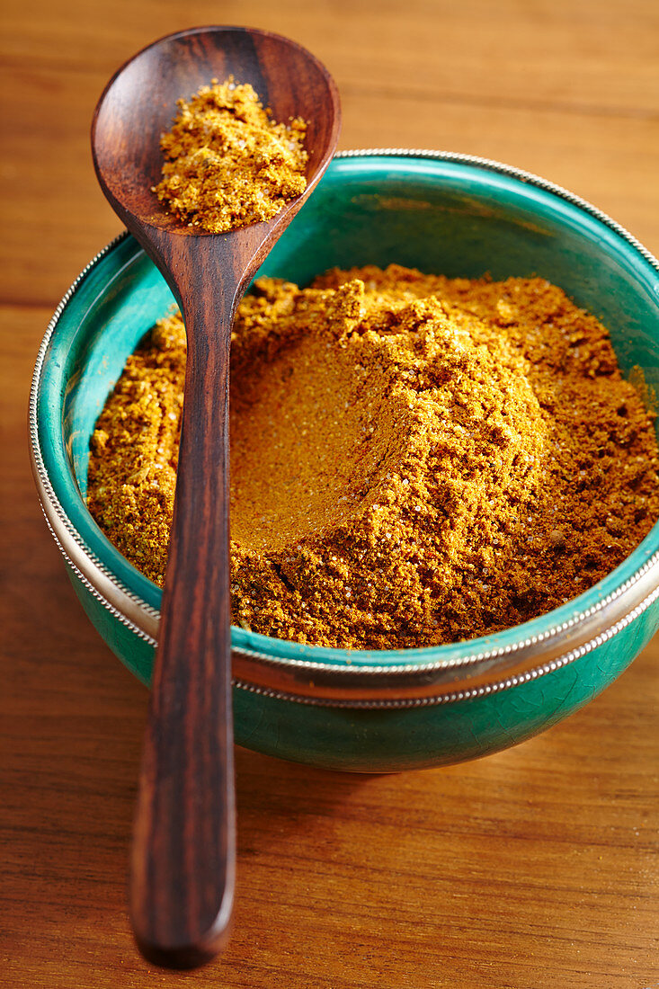 A small bowl of homemade curry spice mixture for barbecuing