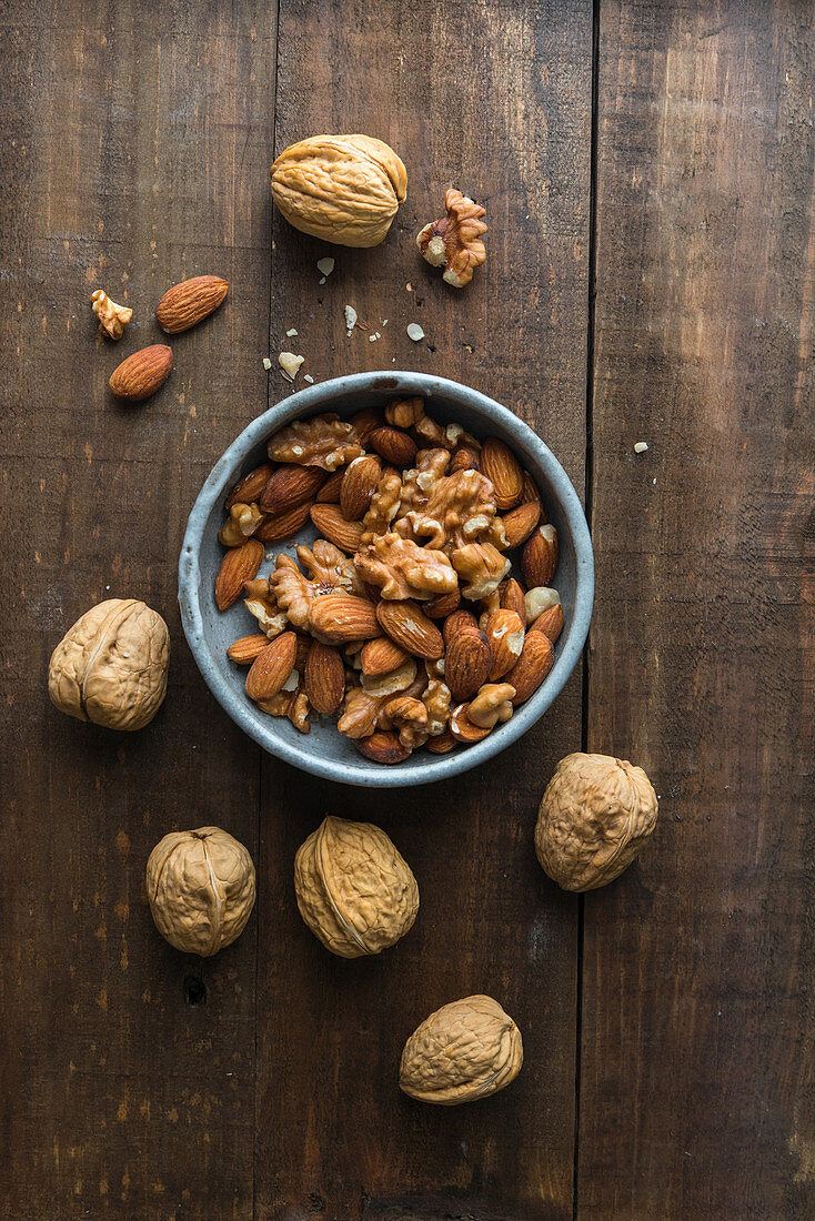 Walnuts and almonds in a ceramic bowl