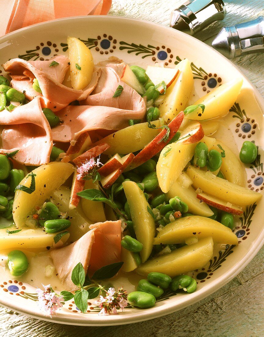 Potato and bean salad with apples and boiled ham