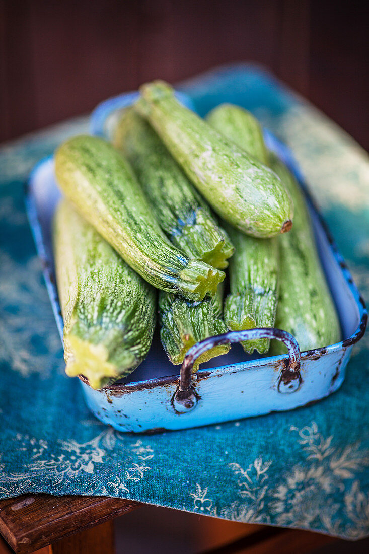 Courgettes in an old baking tin