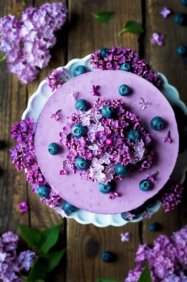 Blueberry cream cake with lilac flowers