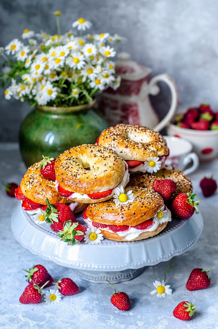 Bagels with whipped cream and strawberries