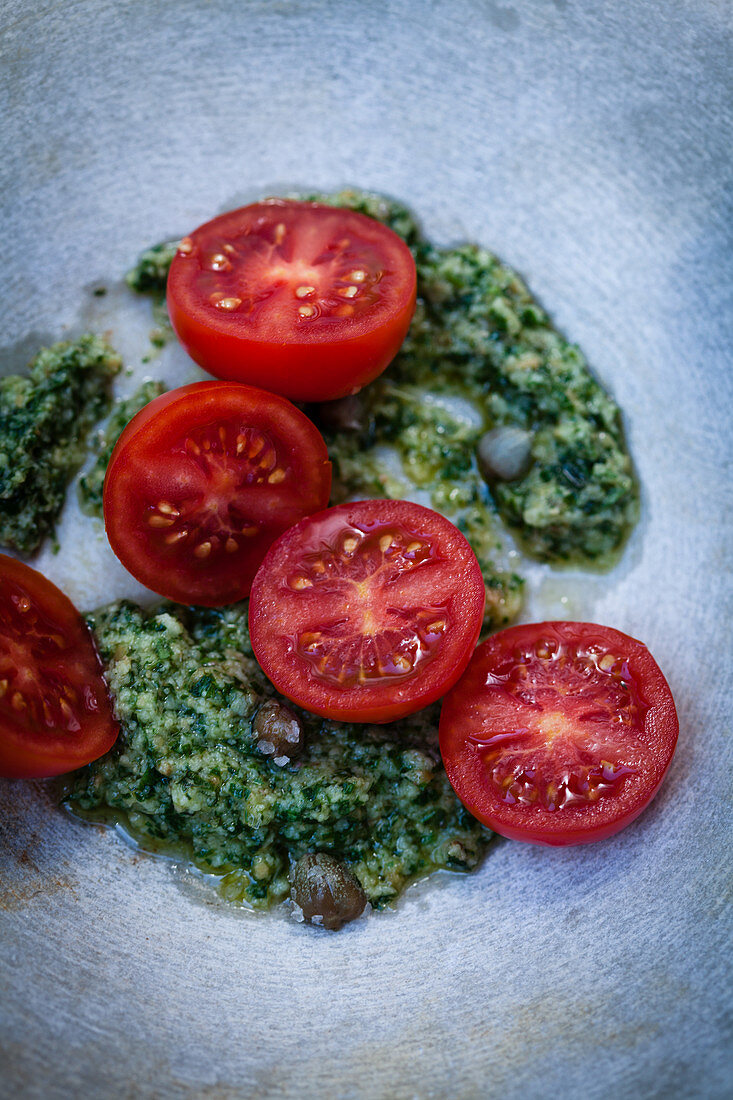Fresh tomatoes with salsa verde and capers