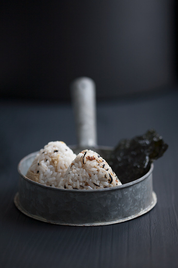 Various onigiri with salty nori in a pot (Japan)