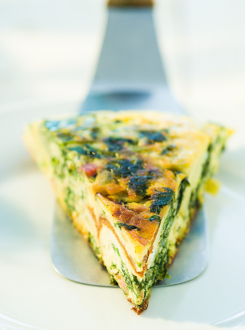 Frittata with wild herbs on a cake slice