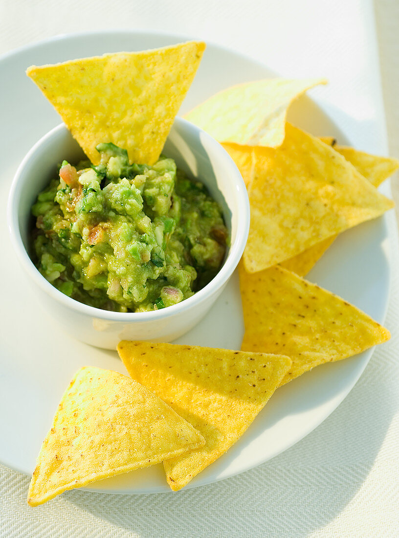 Bowl of Guacamole with Corn Chips