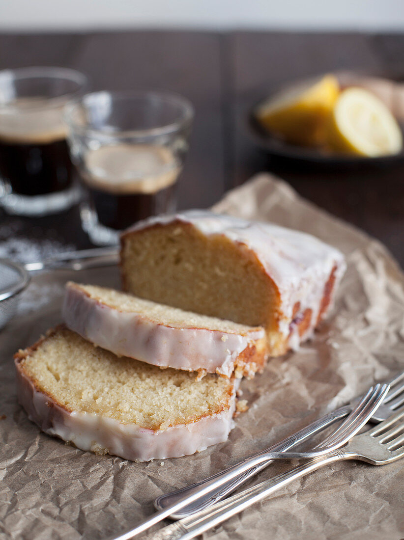 Sliced Lemon Drizzle Loaf Cake with Coffee