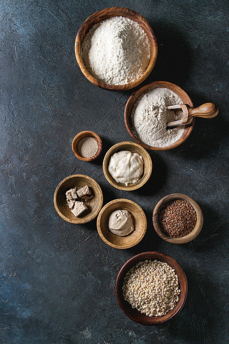 Ingredients for baking bread: Variety of wheat and rye flour, grains, yeast, sourdough