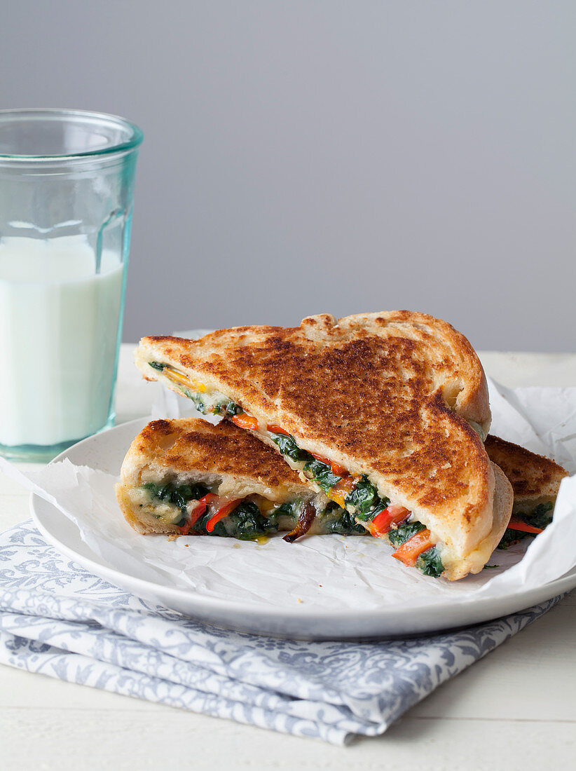 Cheese and Vegetable Toasted Sandwich with Glass of Milk