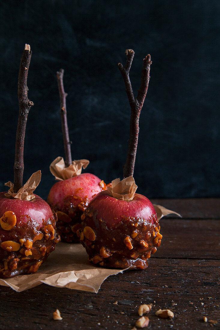Making toffee apples with ripe red apples