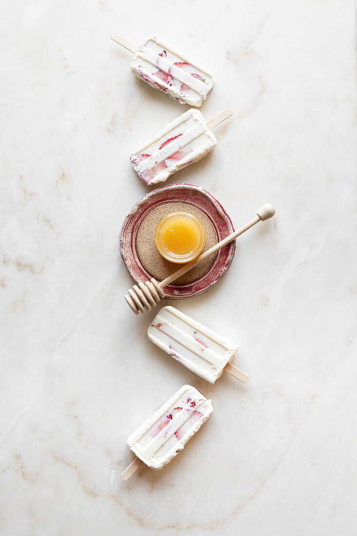 Homemade yoghurt ice cream with fruit and honey