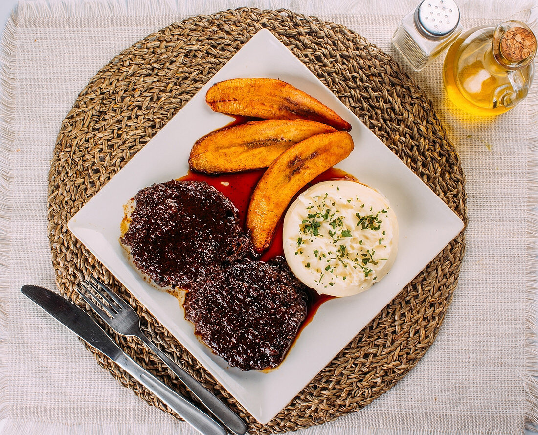 Asado Negro, Beef, Mashed potatoes and Fried plantains (Traditional Venezuelan dish)