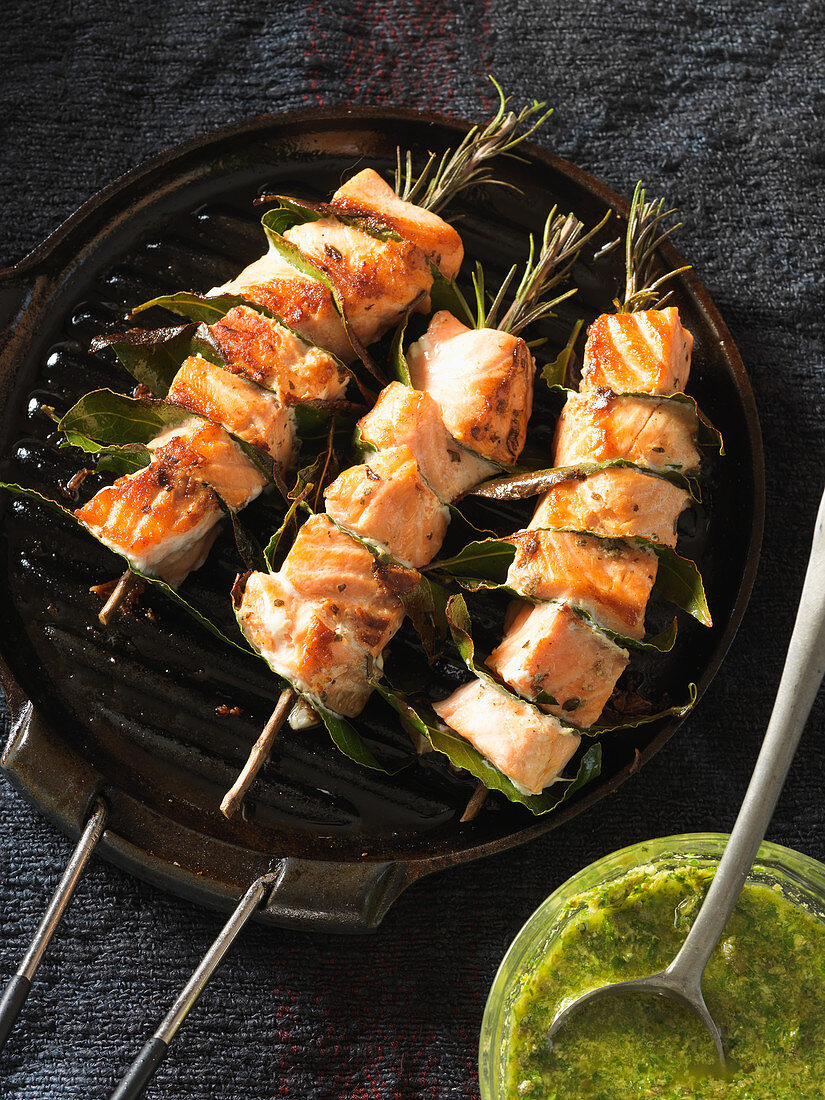 Salmon skewers with rosemary and bay leaves