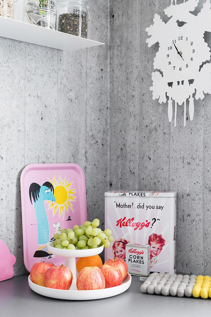 Colourful, vintage-style ornaments and kitchen utensils in corner of kitchen