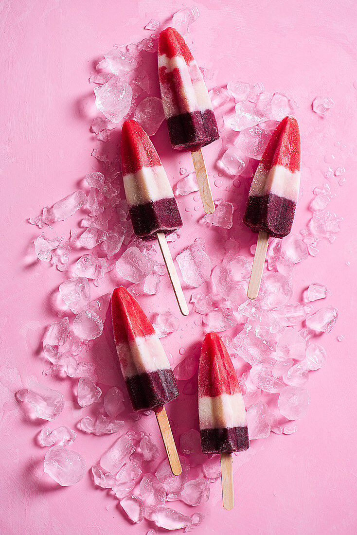 Homemade three colour (strawberry, banana and blueberry) ice lollies