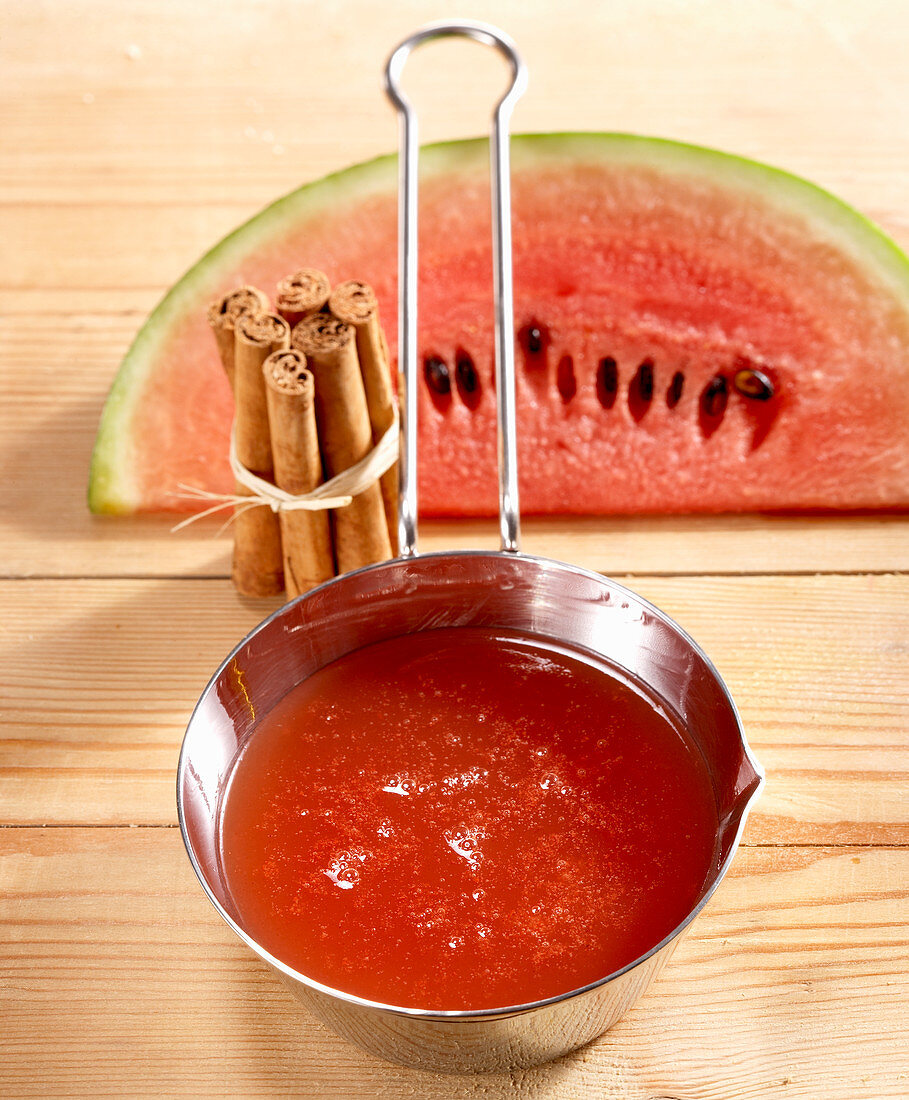 Watermelon and cinnamon jelly in a saucepan