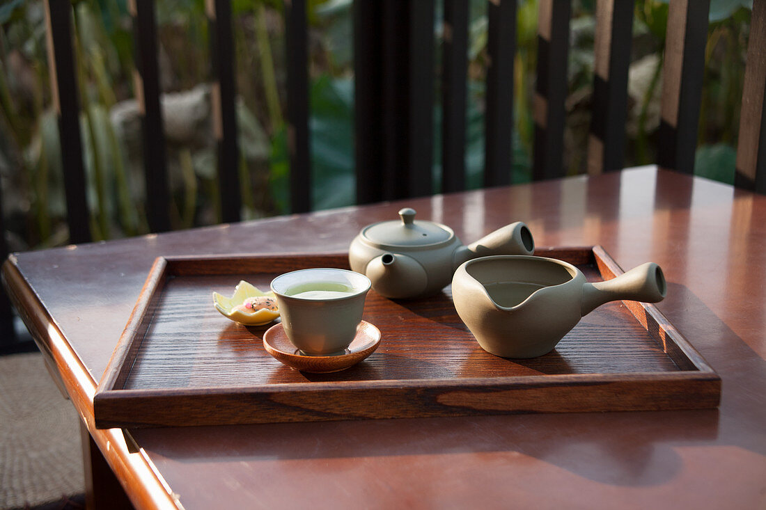 Green tea served near a lotus pond
