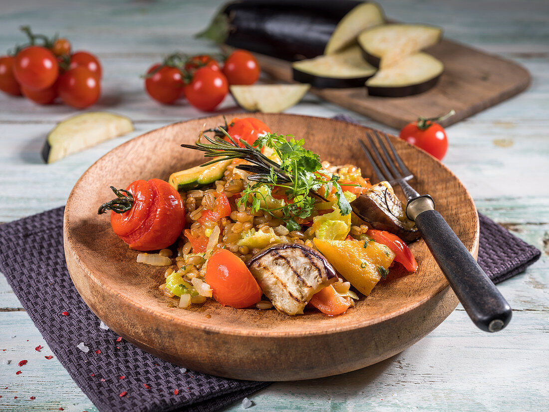 Unripe spelt and vegetables with chervil and rosemary