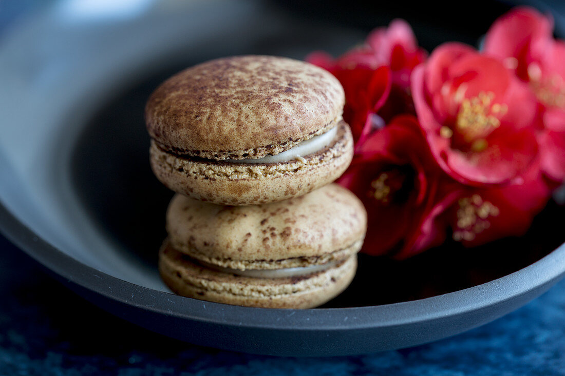 Macarons and flowers in a bowl