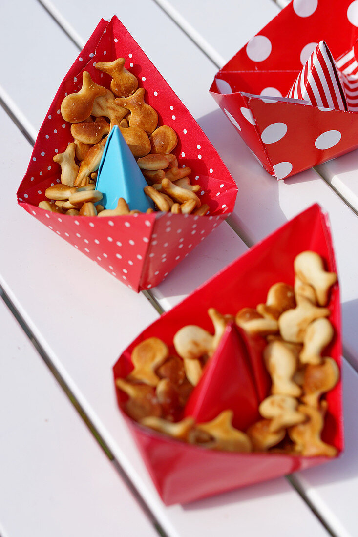 Red paper boats filled with snacks