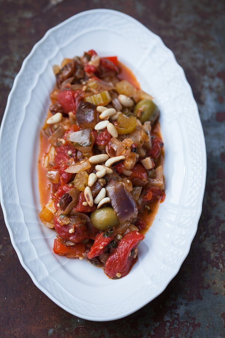 Spicy eggplant with tomatoes and pine nuts