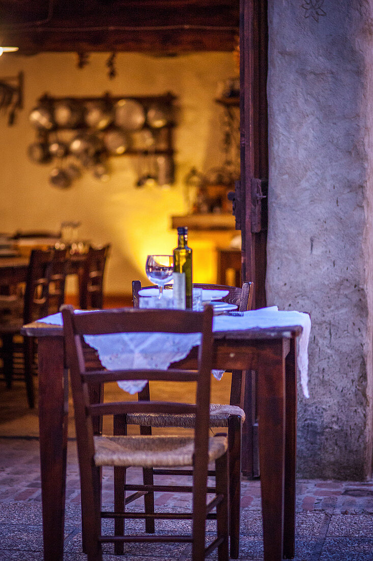 Ristorante with rustic wooden tables (Italy)