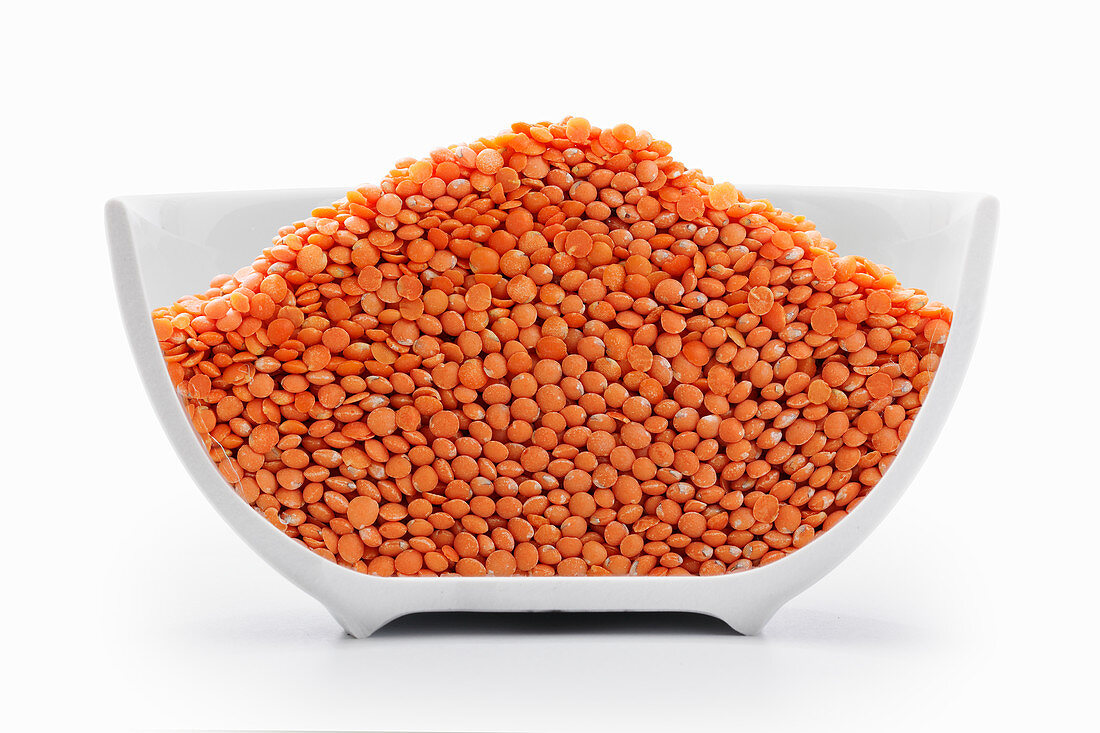 Orange lentils in a cross-cut bowl