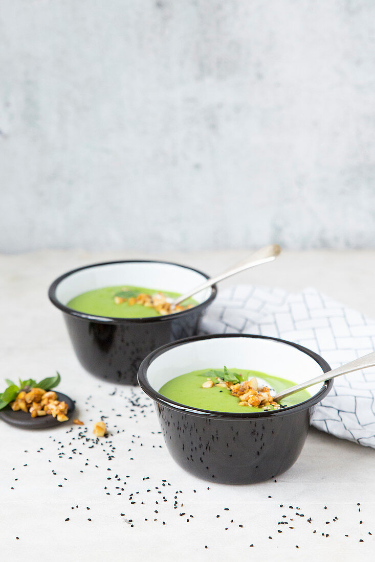Pea soup with nut topping, sesame and yoghurt