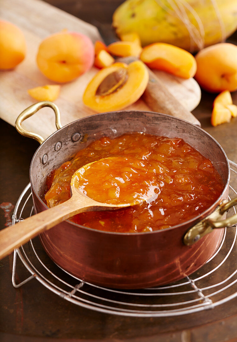 Homemade apricot and vanilla jam in a vintage copper pot