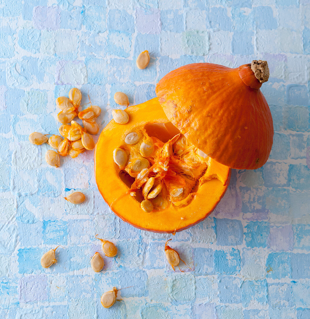 Hokkaido pumpkin, halved, with seeds