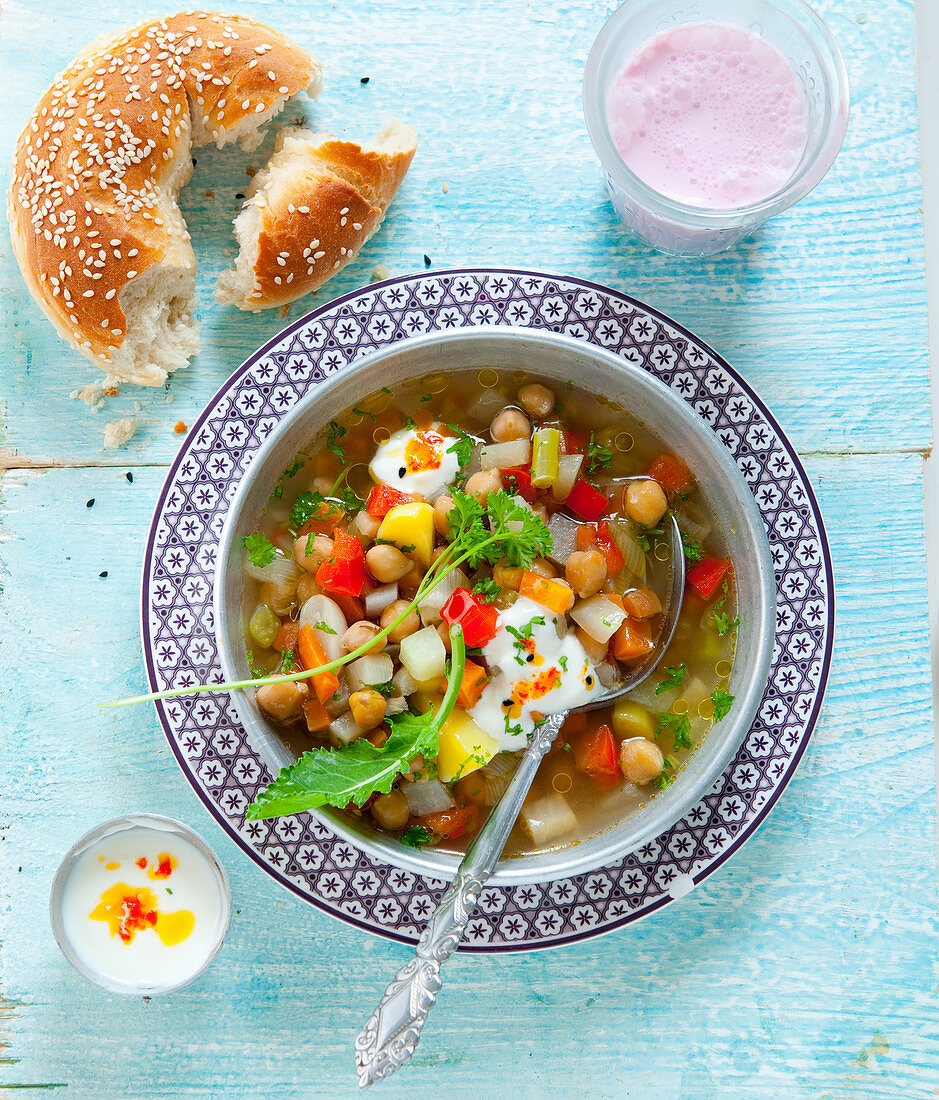 Chickpea soup with sesame bread and chili ayran yoghurt